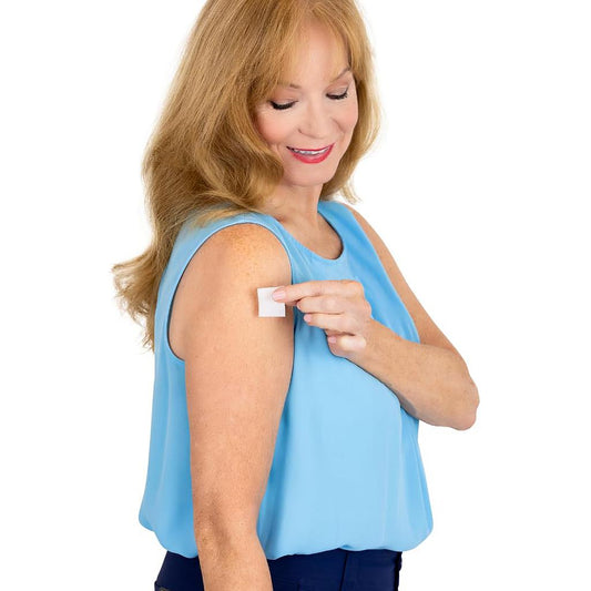 woman removing adhesive using Vive Wipes