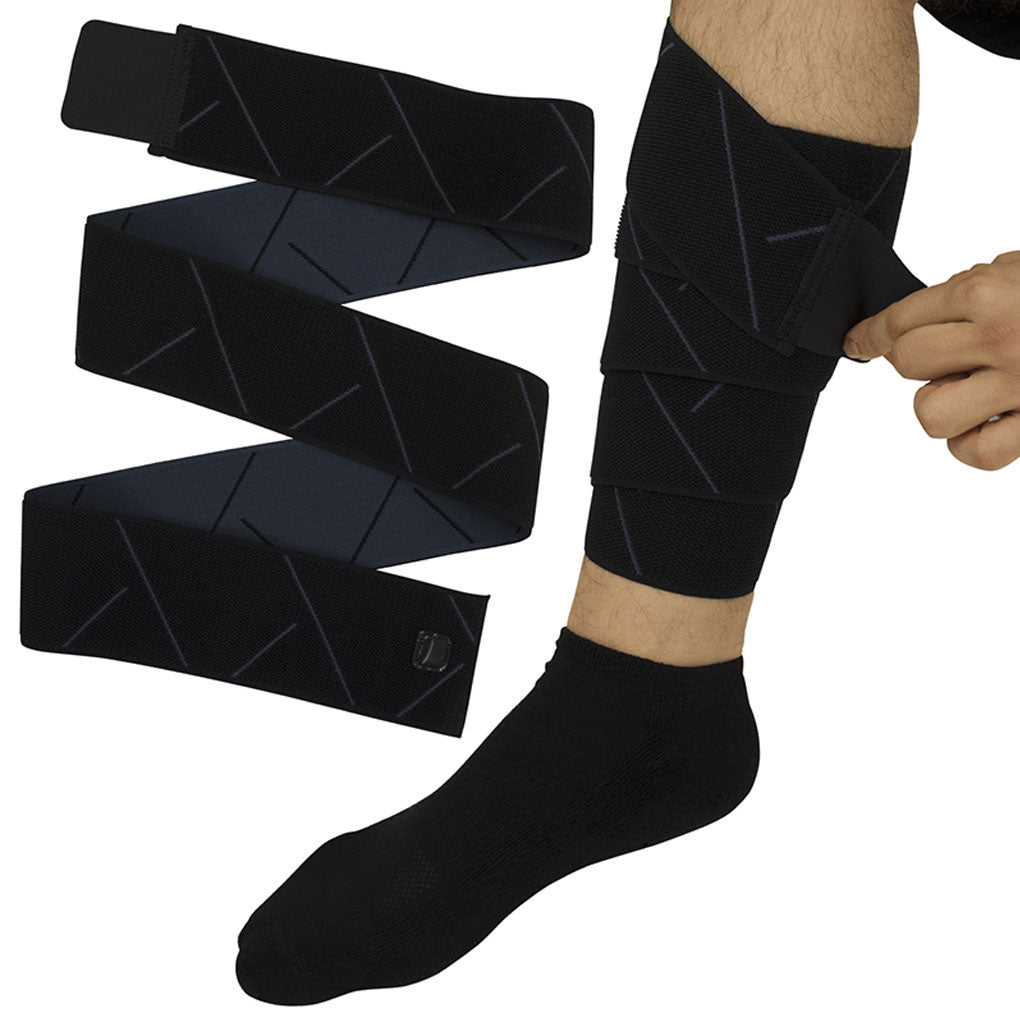 Black compression sleeves on a leg with a white background