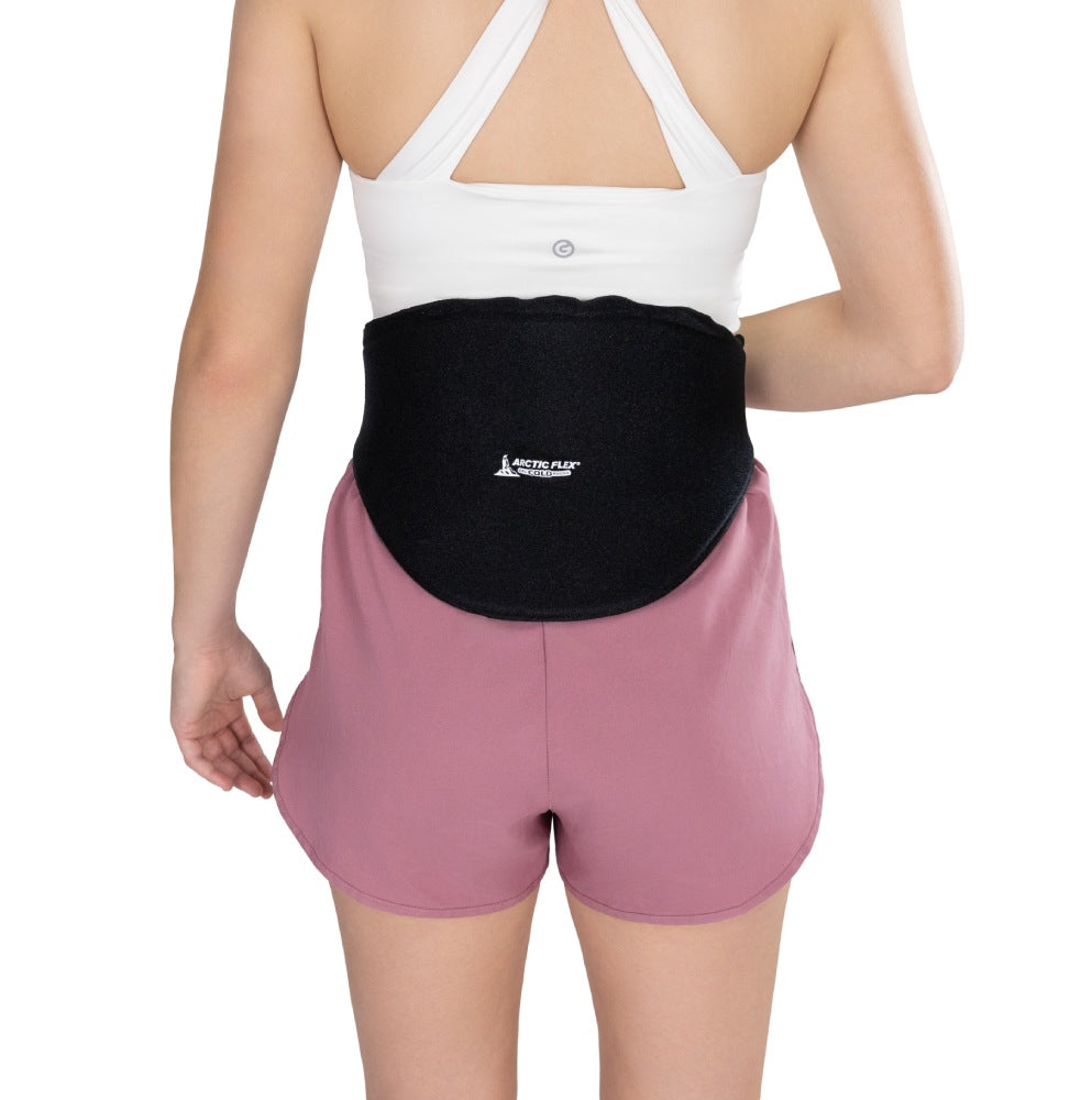 Person wearing a black waist support belt with a visible brand logo on a white background