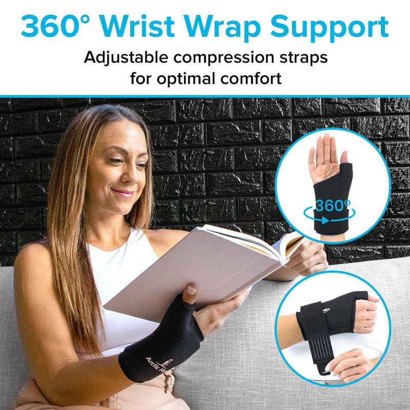 Woman reading a book with a wrist support brace on, against a brick wall background.