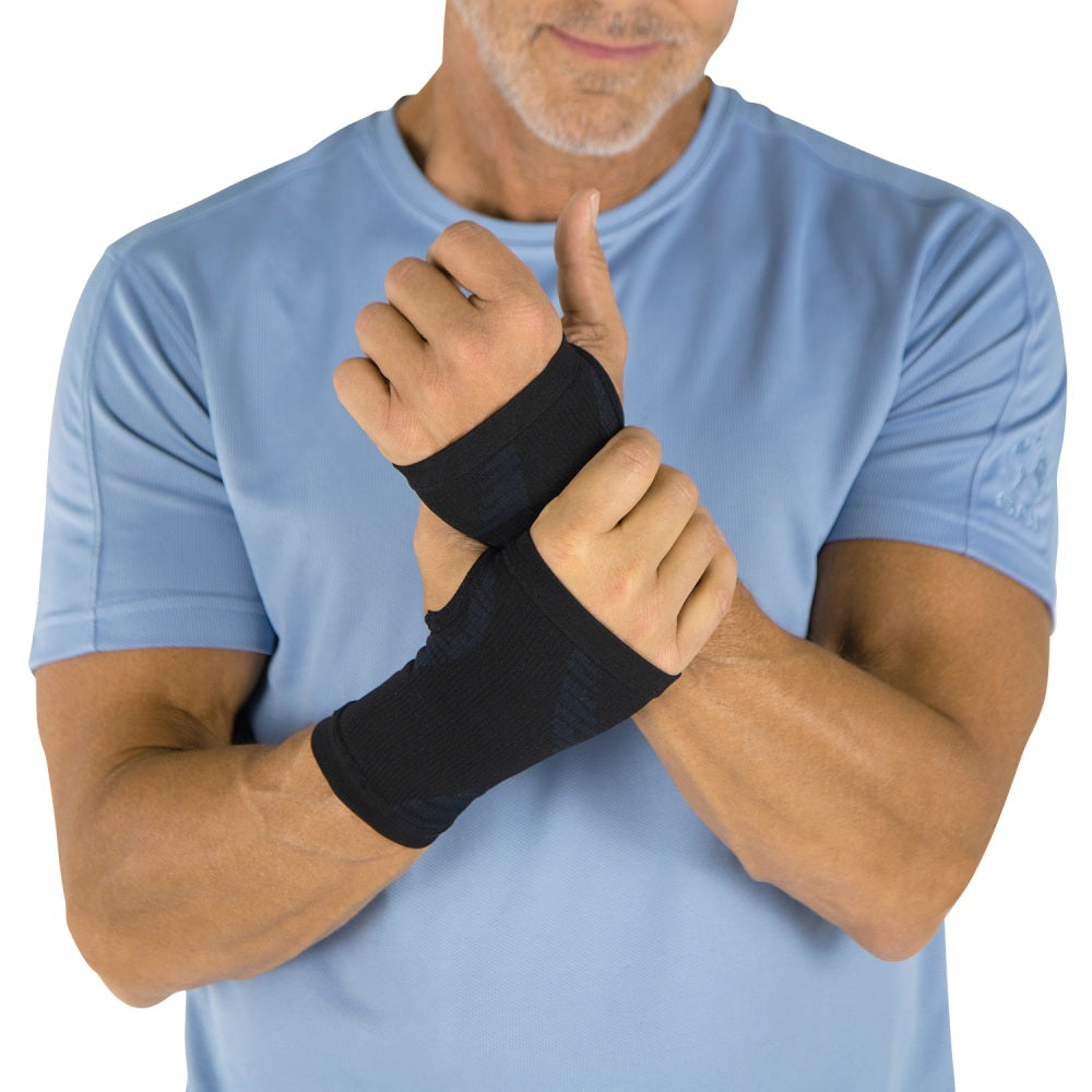 Man wearing black wrist support on a white background