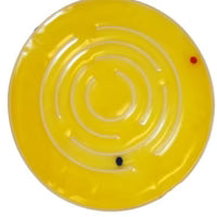 Yellow plastic object with concentric circles on a white background