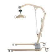A beige electric patient lift with a wheeled base, articulated arm, and hanging gurney platform, shown on a plain white background.
