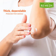 Person applying cream to an arm with 'Medline Remedy' branding.
